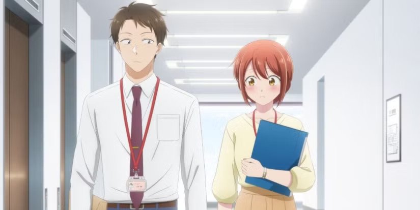 Hai nhân vật chính, một nữ nhân viên và một nam đồng nghiệp, đang làm việc trong một văn phòng hiện đại